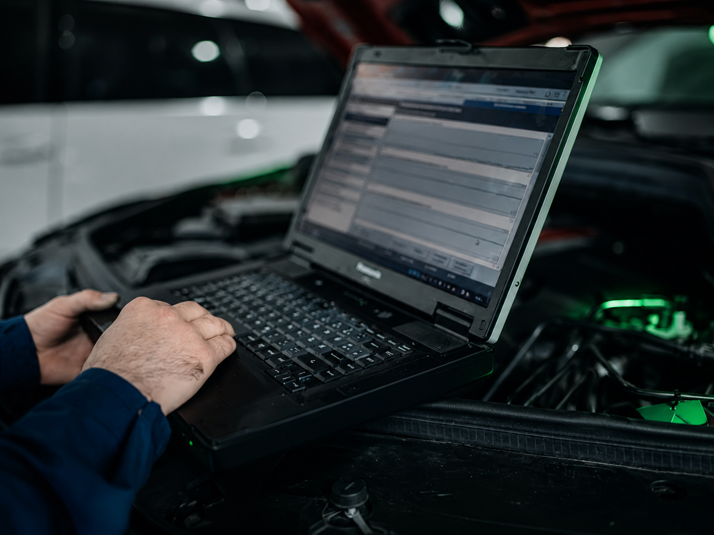 Technician reviewing waveform captures on a diagnostic laptop